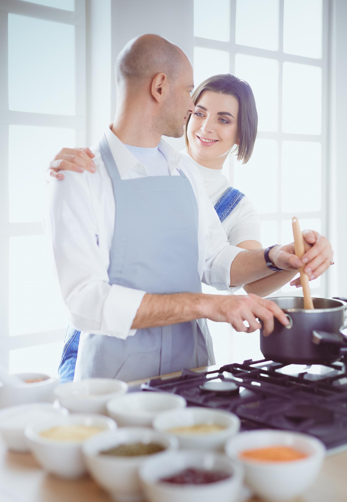 Workshop kitchen interior with chef teaching a group